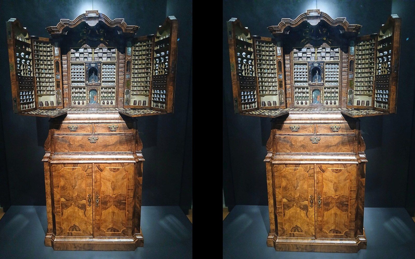 An apothecary cabinet of labelled drawers and glass jars